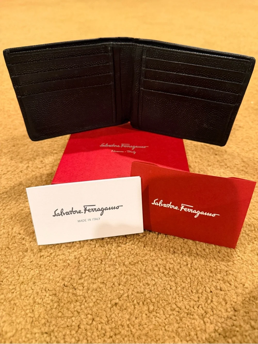 Salvatore Ferragamo Black Pebbled Leather Bi-Fold Wallet with Metal Logo